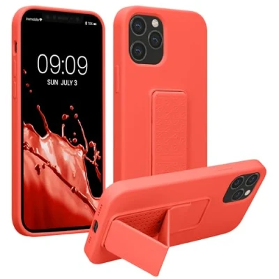 Abbildung von kwmobile Handyhülle kompatibel mit Apple iPhone 12 / Pro Hülle Fingerhalter und Standfunktion Silikon Case Handy Cover in Koralle