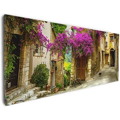 Abbildung von Wallario Leinwandbild Malerische Stadt in der Provence mit bunten Blumen Wandbild 30 x 75 cm: Kunstdruck Brillante lichtechte Farben hochauflösend verzugsfrei