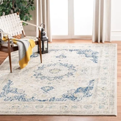 Abbildung von SAFAVIEH Traditionell Teppich für Wohnzimmer, Esszimmer, Schlafzimmer Evoke Collection, Kurzer Flor, Elfenbein und Blau, 201 X 274 cm