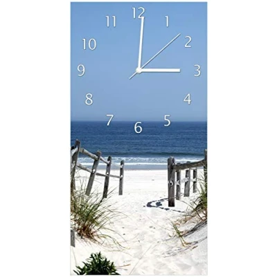 Abbildung von Wallario Design Wanduhr, Acrylglasuhr Größe 30 x 60 cm, weiße Zeiger, Motiv Blick auf Strand