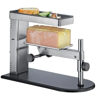 Abbildung von SPRING Raclette Ofen Schweizer Gerät Edelstahl stufenlos höhenverstellbar mit antihaftbeschichteter Grillplatte inklusive Käseschaber Käse Schmelzer 36x17x25cm