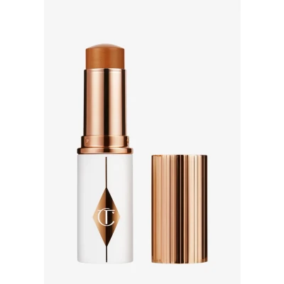 Abbildung von Charlotte Tilbury Unreal SKIN Sheer GLOW TINT Foundation, Damen, Größe: 9 g, 12_tan