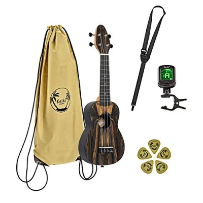 Abbildung von Ortega Guitars Sopran Ukulele natur Keiki K3 Starterkit inklusive Tuner, 5 Medium Plektren &amp; Kordelzugtasche weißes Ebenholz (K3 WEB)