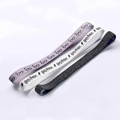 Abbildung von The Carat Shop Haarband Set mit Harry Potter Logo