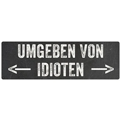Abbildung von Interluxe METALLSCHILD Retro Blechschild Dekoschild UMGEBEN VON IDIOTEN witziges Geschenk