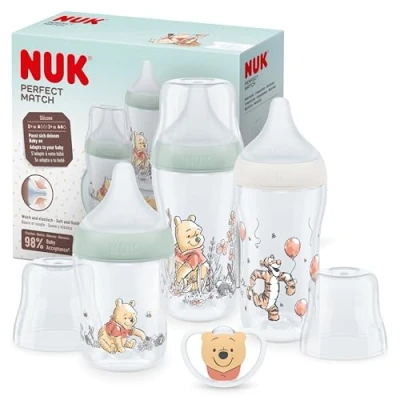 Abbildung von NUK Perfect Match Babyflaschenset Ab 0 Monate Passt sich dem Baby an 3 Anti Colic Babyflaschen und Space Schnuller BPA frei Disneys Winnie Puuh 4 Stück