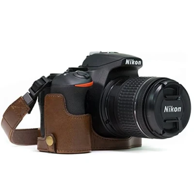 Abbildung von MegaGear MG1171 Ever Ready Leder Kamera Halbtasche mit Trageriemen und Batteriezugang für Nikon D5600, D5500 Dunkelbraun