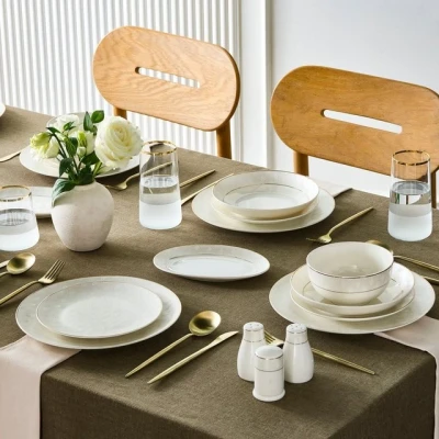 Abbildung von Karaca Geschirr Set Elegance Bone Mandarin 53 teiliges Geschirrset für 12 Personen, Gold Kombigeschirr Tafelservice Tellerset Serviceteller