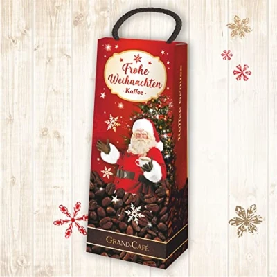 Abbildung von Kaffeebox: Frohe Weihnachten als Geschenk zu für Kaffeeliebhaber und Kaffeegenießer. Witzige Geschenkidee mit Kaffee die Kaffeetasse