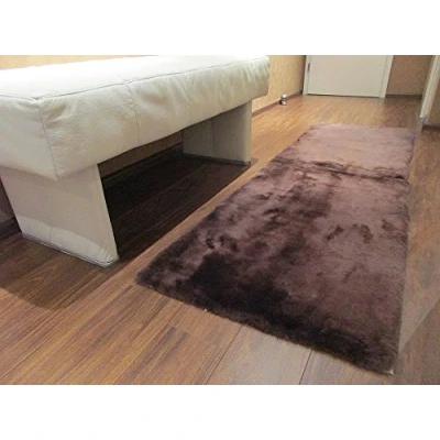 Abbildung von Reissner Lammfelle FP140 Schaffell Teppich Couchauflage Bettvorleger 140x60cm Mocca braun