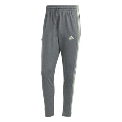 Abbildung von adidas Herren Essentials Single Jersey Tapered Open Hem 3 Stripes Pants, Dark Grey Heather, XS