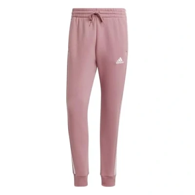 Abbildung von adidas Essentials Fleece Tapered Cuff 3 Stripes Pants, Herren Hose, preloved Crimson,