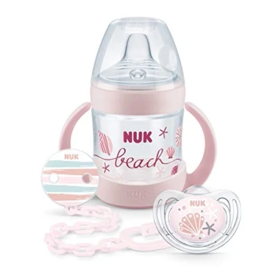 Abbildung von NUK Nature Sense Beach Set, 1 x Trinklernflasche, Freestyle Silikon Schnuller, Schnullerkette, 6 18 Monate (Set rosa)
