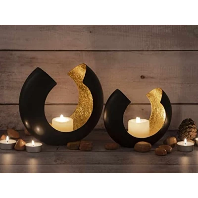 Abbildung von Casamia Windlicht Kerzenhalter Set 2 teilig Teelichthalter Kerzenständer Omega schwarz m