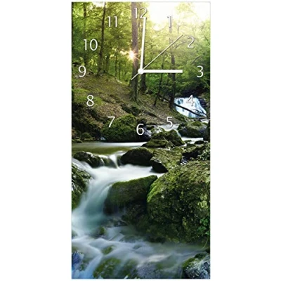Abbildung von Wallario Design Wanduhr, Acrylglasuhr Größe 30 x 60 cm, weiße Zeiger, Motiv Fließender Bach im Wald bei Sonnenuntergang