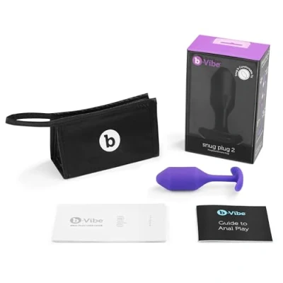 Abbildung von b Vibe The Snug Plug 2 Koralle 114 Gramm Analplug mit ausgestelltem Sockel und gewichteten Kugeln