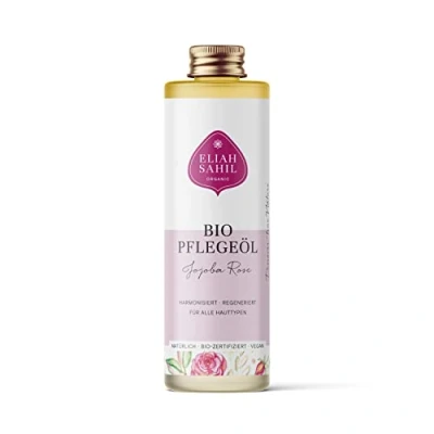 Abbildung von ELIAH SAHIL bio Körper &amp; Haaröl Jojoba Rose 100ml 100% kaltgepresstes Jojobaöl Rosenöl Seidiges Haar weiche Haut Vegan zertifiziert Plastikfreie Glasflasche Nachhaltig