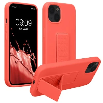 Abbildung von kwmobile Handyhülle kompatibel mit Apple iPhone 13 Hülle Fingerhalter und Standfunktion Silikon Case Handy Cover in Koralle