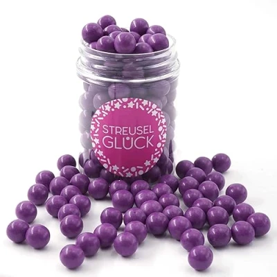 Abbildung von Streusel GLÜCK Tortendeko Schokokugeln lila 90g Zuckerstreusel Geburtstag Kuchendeko Weihnachten Schokoperlen Sprinkles Deko Plätzchen Torte Kuchen Cupcakes essbare Streudeko