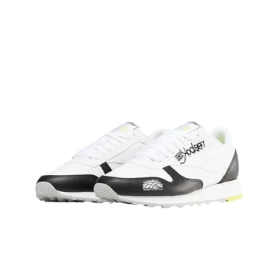 Abbildung von Reebok Unisex Classic Leather Sneaker,Cblack Ftwwht Aciyel,42 EU