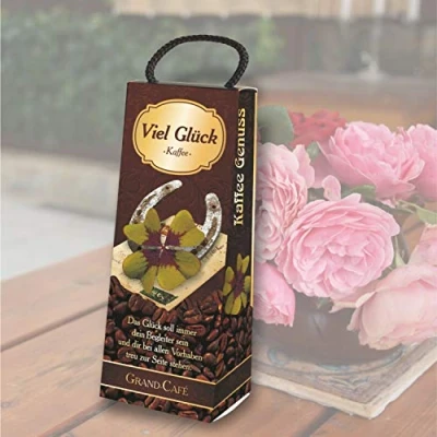 Abbildung von Kaffeebox Viel Glück als Geschenk für Kaffeeliebhaber und Kaffeegenießer. Geschenkidee mit Kaffee Geburtstagsgeschenk die Kaffeetasse