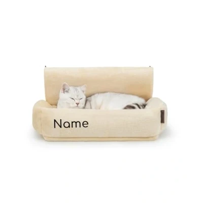 Abbildung von lionto Katzenheizungsliege mit kuscheligem Plüschbezug, Katzenbett zum Einhängen Metallhaken für alle gängigen Heizungen, waschbare und gemütliche Katzenhängematte, beige (Namensaufdruck)