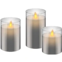 Abbildung von goobay 57865 3er Set LED Echtwachskerzen im Glas (grau) mit Timerfunktion, warmweißer Kerzenschein, bewegliche Flamme, 10, 12,5 &amp; 15cm hohe Kerzen Transparent