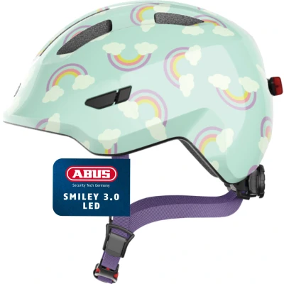 Abbildung von ABUS Kinderhelm Smiley 3.0 LED Fahrradhelm mit Licht tiefe Passform &amp; Platz für einen Zopf Mädchen und Jungs Hellblau Regenbogen Muster, Größe S