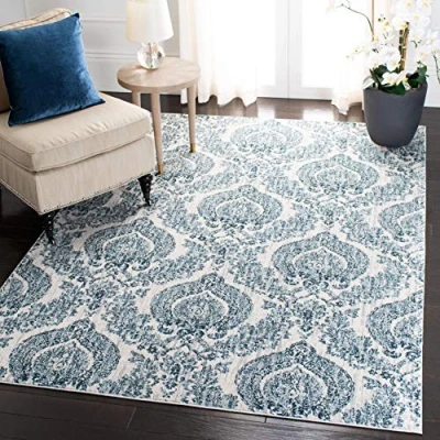 Abbildung von SAFAVIEH Traditionell Teppich für Wohnzimmer, Esszimmer, Schlafzimmer Isabella Collection, Kurzer Flor, Marine und Elfenbein, 122 X 183 cm