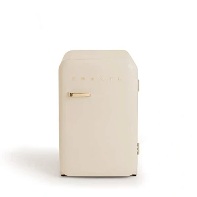 Abbildung von CREATE / RETRO FRIDGE 83.5 GOLD/Kühlschrank in Cremeweiß, Griff Gold 98W, niedriger Verbrauch, 2 Ablagen, Temperaturregler, Flaschenhalter, 56x54x84cm