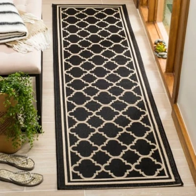 Abbildung von SAFAVIEH Geometrisch Teppich für Wohnzimmer, Esszimmer, Schlafzimmer Wasserdicht Courtyard Collection, Kurzer Flor, Schwarz und Beige, 69 X 244 cm