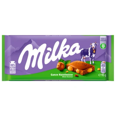 Abbildung von Milka Tafelschokolade Ganze Haselnüsse, 95g, 0.095 von FROG.coffee