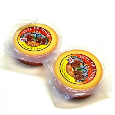 Abbildung von Tete de Moine AOP Classic Mönchskopfkäse 2x400g zwei halbierte Laibe für Girolle Käsehobel KÜHLBOX Versand mit Styroporbox und Spezialkühlakku Lebensmittelversand