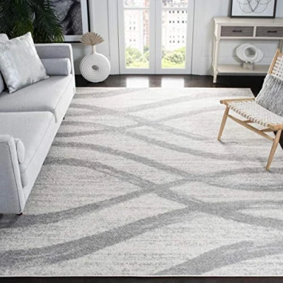 Abbildung von SAFAVIEH Distressed Teppich für Wohnzimmer, Esszimmer, Schlafzimmer Adirondack Collection, Kurzer Flor, Creme und Grau, 183 X 274 cm