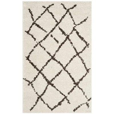 Abbildung von SAFAVIEH Zottelig Teppich für Wohnzimmer, Esszimmer, Schlafzimmer Berber Shag Collection, Kurzer Flor, Creme und Braun, 91 X 152 cm