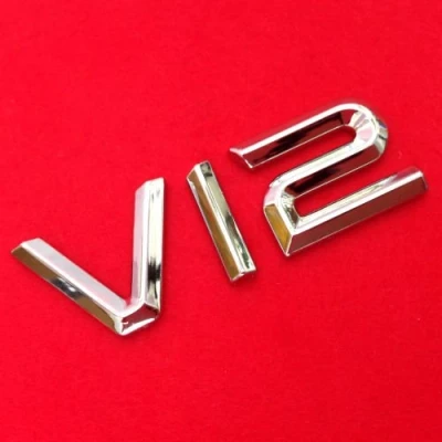 Abbildung von AutoScheich® V12 Emblem Zeichen Chrom Schriftzug Auto Aufkleber Motorhaube Kotflügel Logo 3D