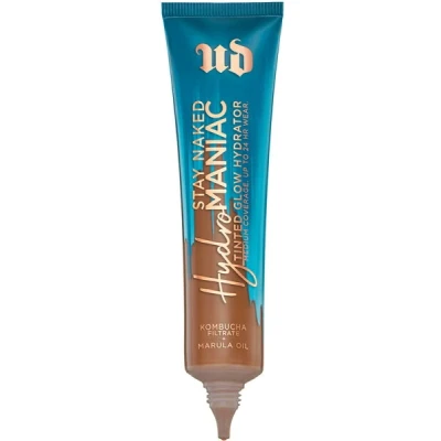 Abbildung von Urban Decay Hydromaniac getönte Feuchtigkeitscreme, 70 Dunkelwarm 24 Stunden lang haltbar, schwerelos, aufbaubare mittlere Abdeckung für gesunde, leuchtende Haut mit Kombucha Filtrat und Marula Öl