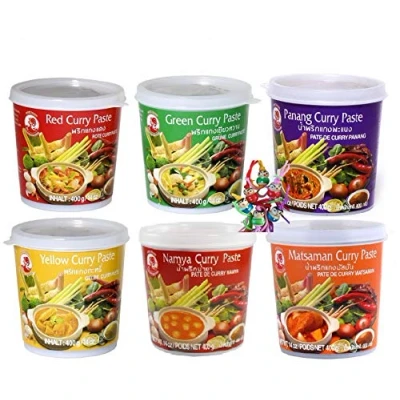Abbildung von COCK 6 verschiedene Curry Paste je 1x400g [Rote, Gelbe, Grüne, Panang, Matsaman, Namya] + ein kleines Glückspüppchen Holzpüppchen