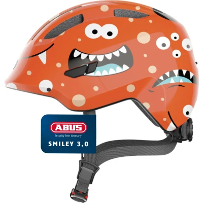 Abbildung von ABUS Kinderhelm Smiley 3.0 Fahrradhelm mit tiefer Passform, kindergerechten Designs &amp; Platz für einen Zopf Mädchen und Jungs Orange Monster Muster, Größe M