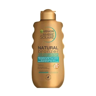 Abbildung von Garnier Natural Bronzer Selbstbräunungsmilch für eine gleichmäßige und natürliche Bräunung, schnell einziehend, feuchtigkeitsspendend glättend, mit Aprikosenöl Vitamin E, Ambre Solaire