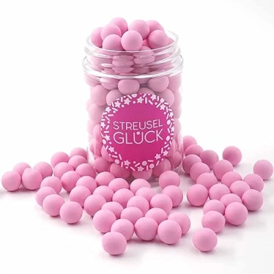 Abbildung von Streusel GLÜCK Tortendeko Schokokugeln rosa pastell 90g Zuckerstreusel Geburtstag Kuchendeko Weihnachten Schokoperlen Sprinkles Deko Plätzchen Torte Kuchen Cupcakes essbare Streudeko