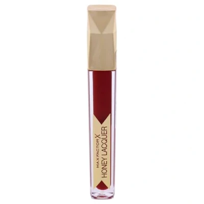 Abbildung von Max Factor Honey Lacquer Floral Ruby 25 Lippenstift Farbe, Lipgloss Glanz und Lipbalm Feuchtigkeit in Einem Kräftige geschmeidig glänzend