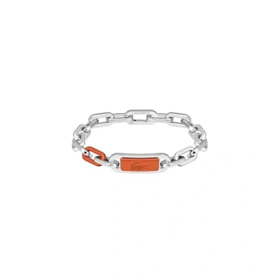 Abbildung von Lacoste Herren Gliederarmband Kollektion CREW aus Edelstahl (Silber oder Gold) mit einer Farbigen Gravierten Plakette