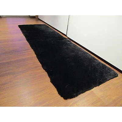 Abbildung von Reissner Lammfelle FP140 Schaffell Teppich Couchauflage Bettvorleger 140x60cm schwarz