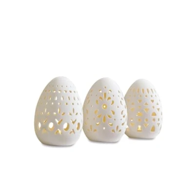 Abbildung von Loberon Osterei 3er Set Mouna, kunstvolle Ausstanzungen, warmes LED Licht, batteriebetrieben, Wohn Accessoire, Ostern, Osterdeko, Porzellan, weiß