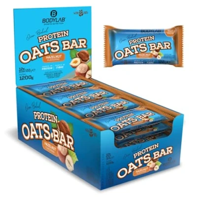 Abbildung von Bodylab24 Protein Oats Bar Haselnuss 12 x 100g, Energieriegel mit 50g Kohlenhydraten und 15g pro Riegel, Top Kombination aus Energie Eiweiß, ideal vor oder nach dem Training