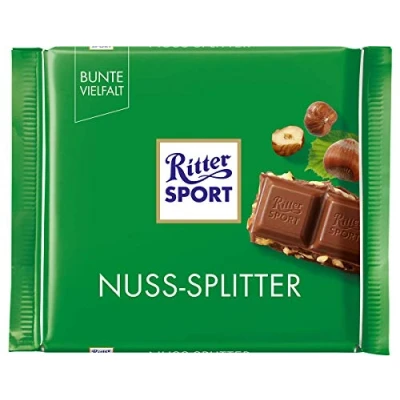 Abbildung von Ritter Sport Nuss Splitter (12 x 100 g), Vollmilchschokolade mit Haselnuss Stückchen, knackige Tafelschokolade, Schokolade Nüssen