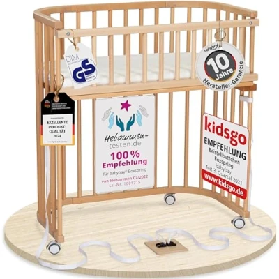 Abbildung von babybay Boxspring Beistellbett aus massivem Buchenholz/kompakt &amp; verwandelbar/Kinderbett Höhe stufenlos verstellbar/mitwachsendes Babybett (Natur lackiert) / inkl. Matratze, Gitter, Rollen