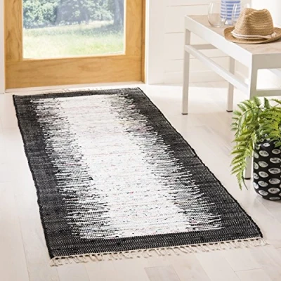 Abbildung von SAFAVIEH Modern Teppich für Wohnzimmer, Esszimmer, Schlafzimmer Montauk Collection, Kurzer Flor, Elfenbein und Schwarz, 69 X 213 cm
