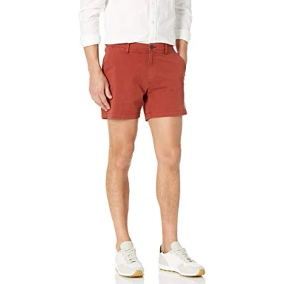 Abbildung von Amazon Essentials Herren 13 cm Flatfront Chinoshorts mit hohem Comfort in schmaler Passform (zuvor Goodthreads), Rostfarben, 28W